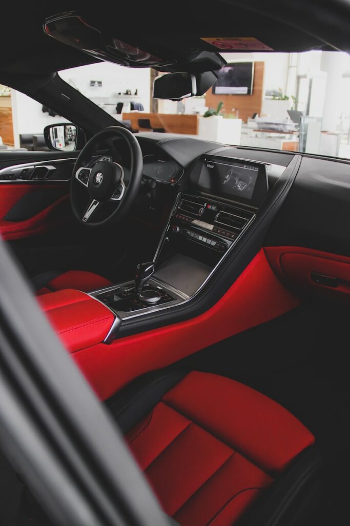 black and red car interior during daytime
